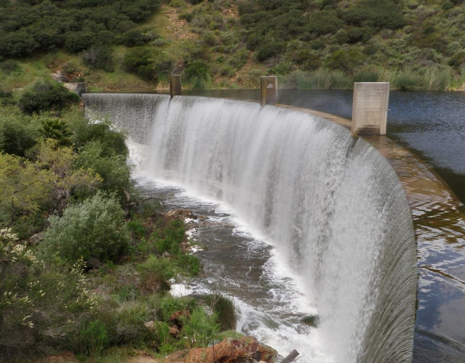 water flowing over a dam